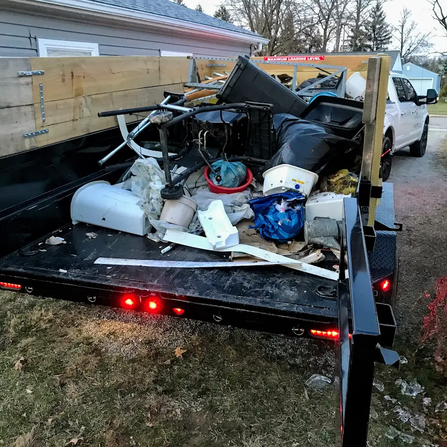 Roll-off dumpster delivered to a residential driveway in Adelphi