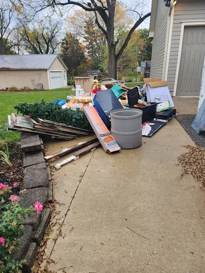 Dumpster being loaded with debris for Commercial Dumpster Rental in Adelphi